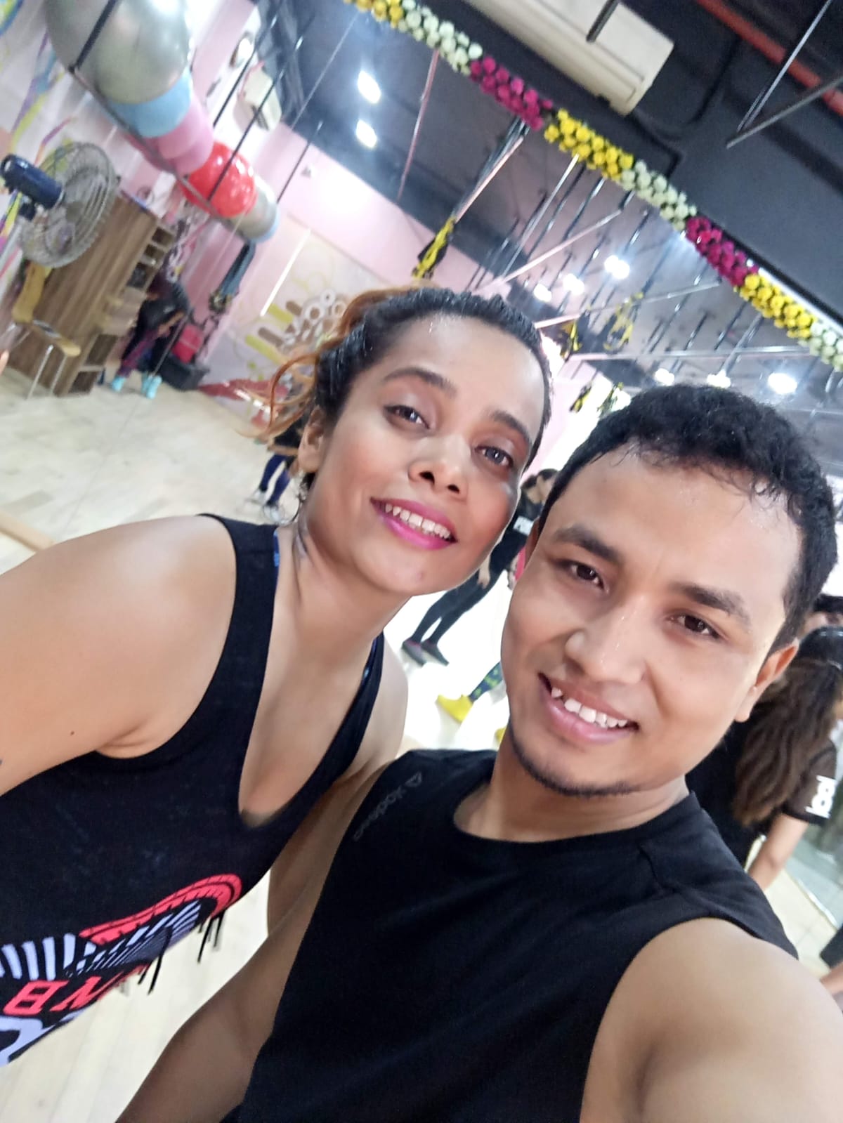 Outdoor yoga session with participants on mats in natural setting, peaceful sunrise lighting, instructor demonstrating poses, serene atmosphere