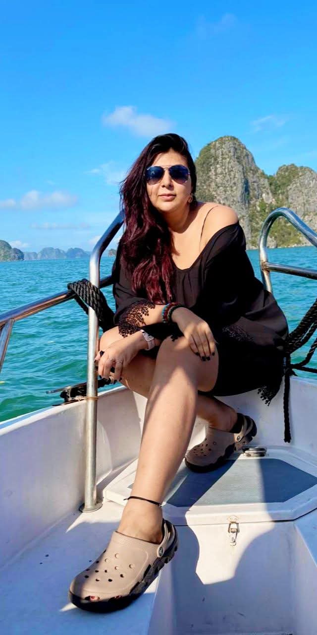 Professional headshot of satisfied client Meera Singh, elegant woman in traditional Indian attire with warm expression and traditional jewelry